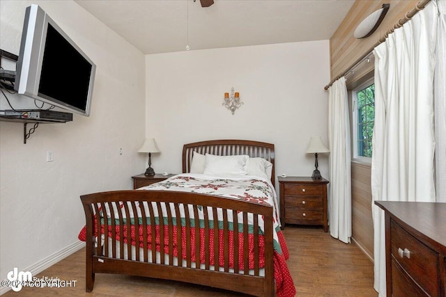 bedroom with wood-type flooring