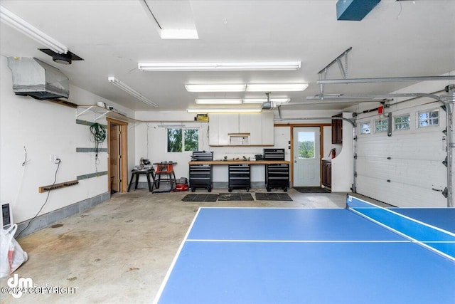 garage featuring a garage door opener and beverage cooler