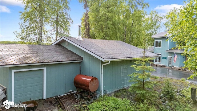 view of property exterior with a garage