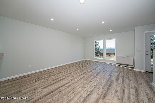 spare room with light hardwood / wood-style flooring