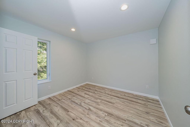 spare room featuring light hardwood / wood-style flooring