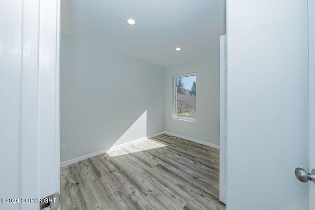 unfurnished room featuring light hardwood / wood-style floors