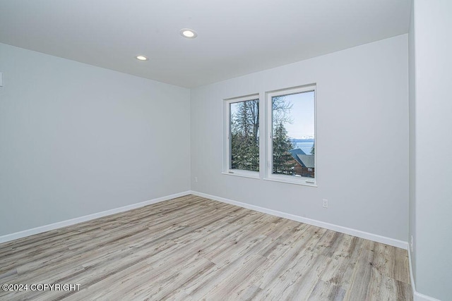 spare room with light hardwood / wood-style floors