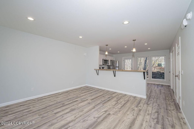 interior space with light hardwood / wood-style flooring