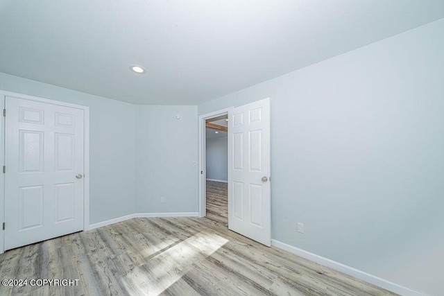 unfurnished bedroom featuring light hardwood / wood-style flooring