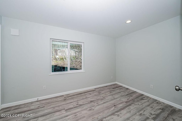 empty room with light wood-type flooring