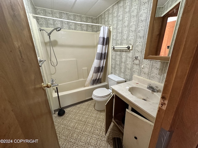 full bathroom featuring toilet, vanity, a textured ceiling, and shower / bath combo with shower curtain