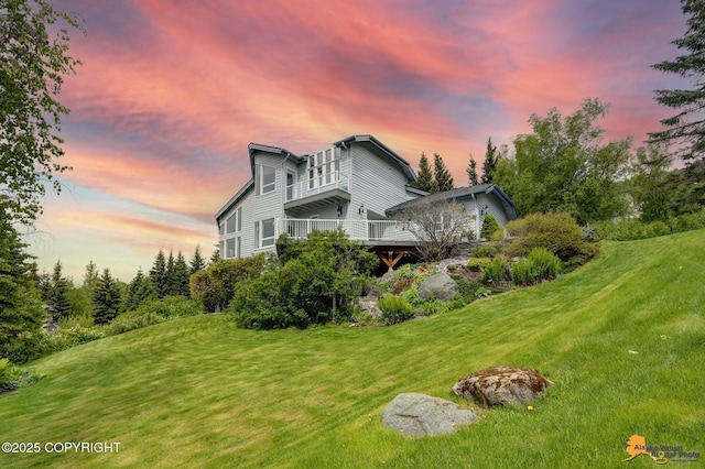 18706 Petrel Cir, Anchorage, AK 99516 - view of side of property with a yard and a balcony