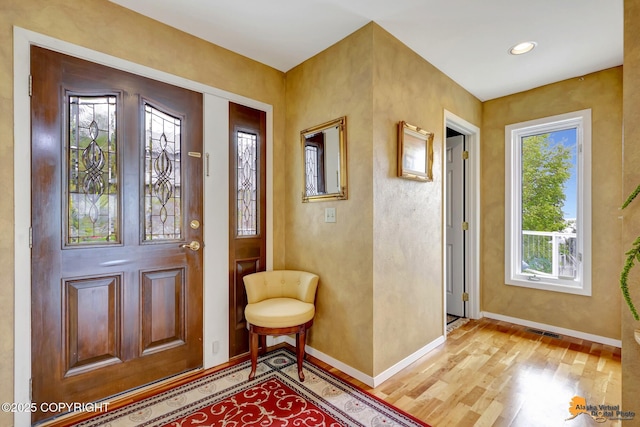 18706 Petrel Cir, Anchorage, AK 99516 - entrance foyer with baseboards and light wood-style flooring