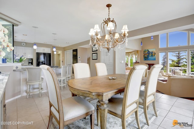 18706 Petrel Cir, Anchorage, AK 99516 - dining space with light tile patterned floors and a chandelier