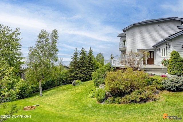 18706 Petrel Cir, Anchorage, AK 99516 - view of grassy yard with a balcony