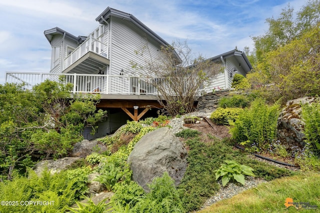 18706 Petrel Cir, Anchorage, AK 99516 - view of property exterior with a balcony and a deck