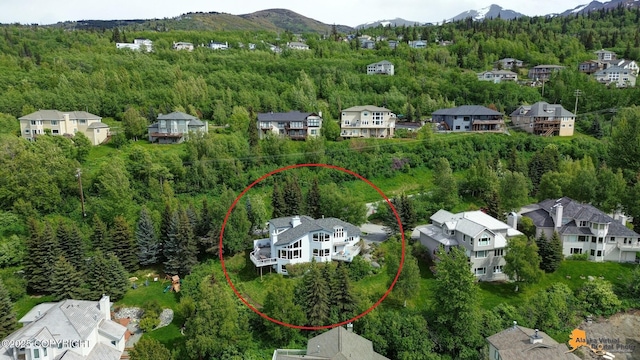 18706 Petrel Cir, Anchorage, AK 99516 - aerial perspective of suburban area featuring a forest and mountains