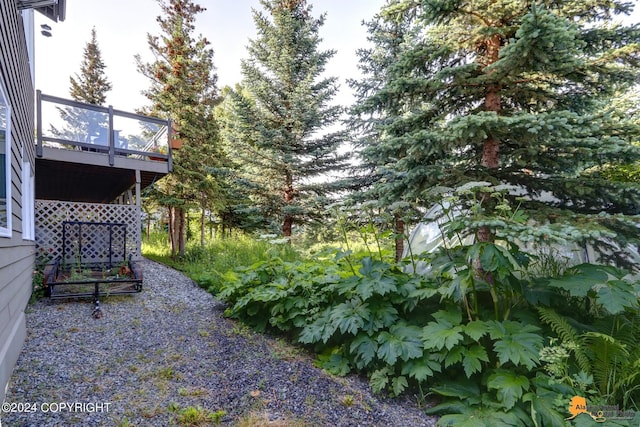 16268 Noble Point Dr, Anchorage, AK 99516 - view of yard with a wooden deck
