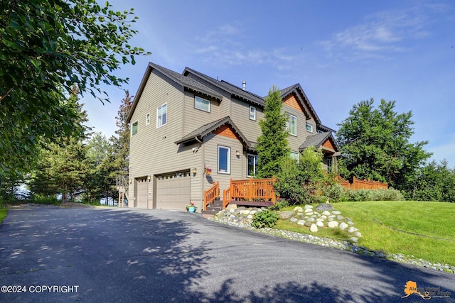 16268 Noble Point Dr, Anchorage, AK 99516 - view of front of property with a garage, driveway, and a front yard