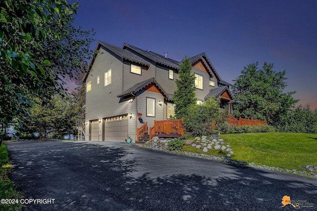 16268 Noble Point Dr, Anchorage, AK 99516 - view of front facade featuring a garage, asphalt driveway, and a front lawn