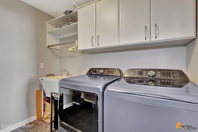 16268 Noble Point Dr, Anchorage, AK 99516 - laundry area with washer and dryer, cabinet space, and tile patterned flooring