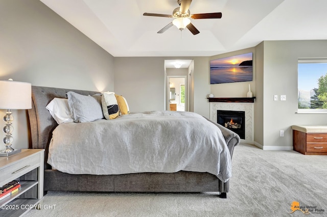 16268 Noble Point Dr, Anchorage, AK 99516 - bedroom with carpet flooring, a glass covered fireplace, ceiling fan, and a tray ceiling