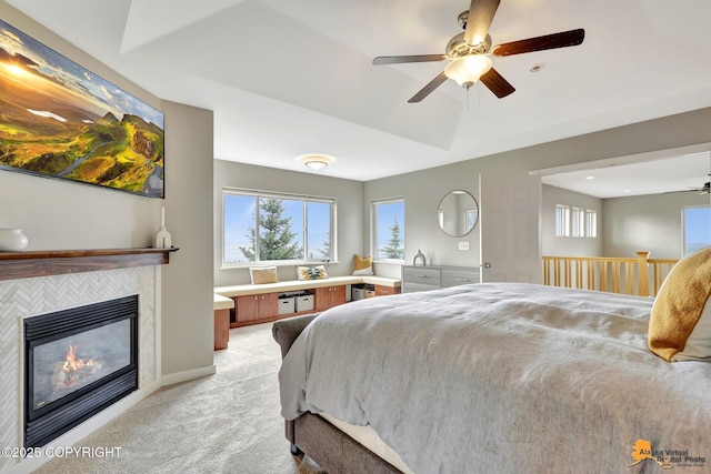 16268 Noble Point Dr, Anchorage, AK 99516 - bedroom featuring light carpet, multiple windows, a tile fireplace, and ceiling fan