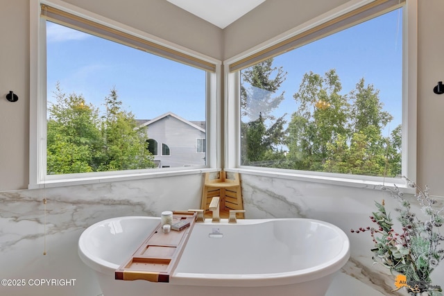 16268 Noble Point Dr, Anchorage, AK 99516 - bathroom featuring a freestanding tub and plenty of natural light