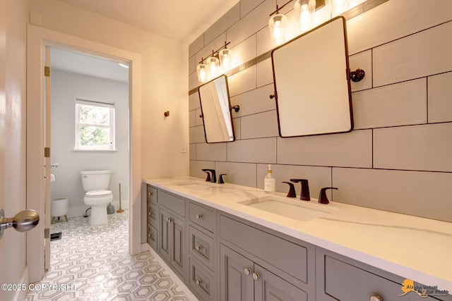 16268 Noble Point Dr, Anchorage, AK 99516 - bathroom with double vanity, tile patterned flooring, and backsplash