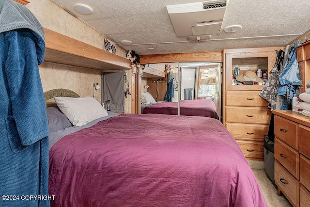 bedroom with light carpet and a closet