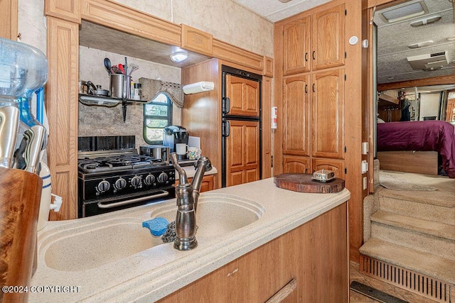 kitchen featuring black range with gas cooktop