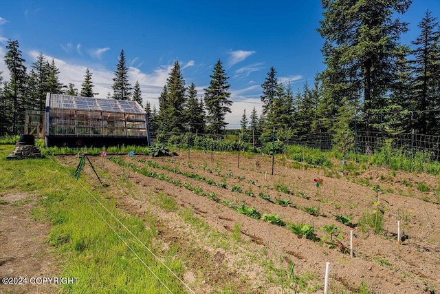 view of yard with a rural view and an outdoor structure