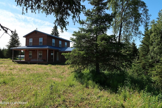 back of property featuring a porch