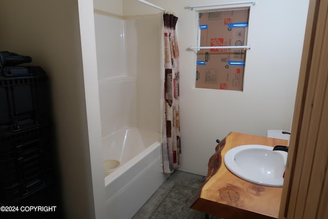 bathroom with shower / bath combo and sink