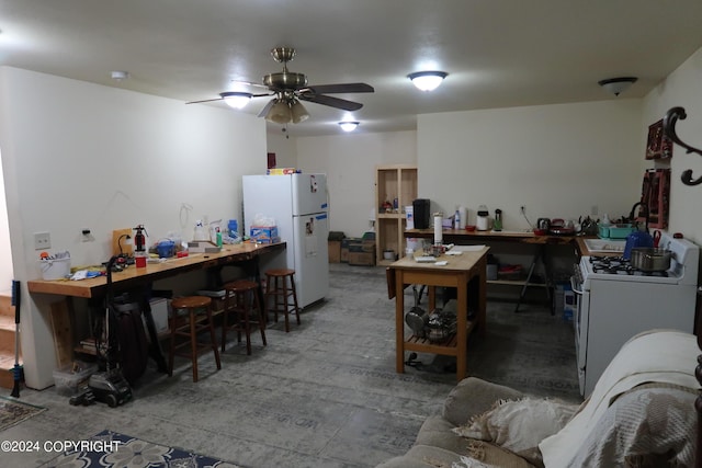 kitchen featuring ceiling fan and white appliances