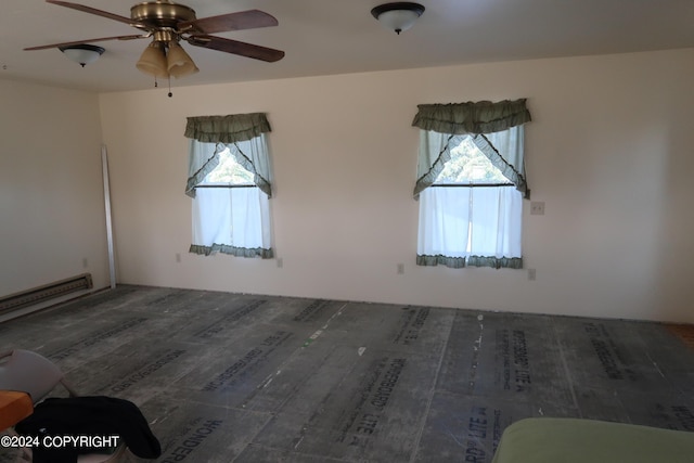 spare room with ceiling fan and dark wood-type flooring