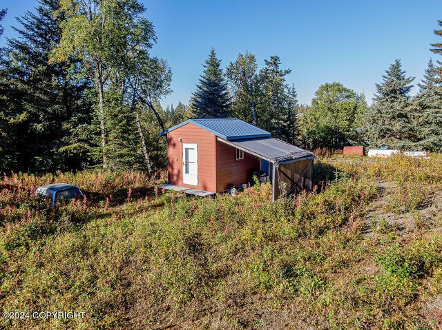 exterior space with a shed