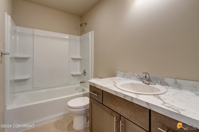 full bathroom featuring toilet, vanity, and shower / tub combination