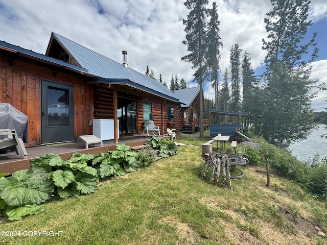 34335 Keystone Dr, Soldotna, AK 99669 - view of grassy yard with a wooden deck