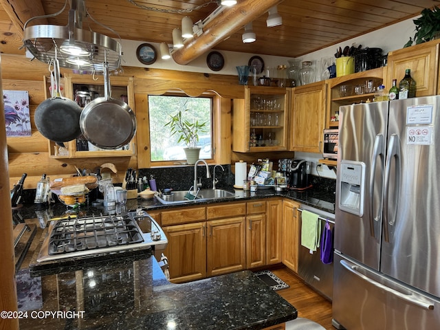 34335 Keystone Dr, Soldotna, AK 99669 - kitchen featuring stainless steel appliances, open shelves, a wooden ceiling with exposed beams, dark stone countertops, and wood finished floors