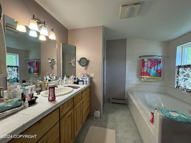 34335 Keystone Dr, Soldotna, AK 99669 - bathroom featuring a baseboard heating unit, a garden tub, tile patterned flooring, vanity, and lofted ceiling