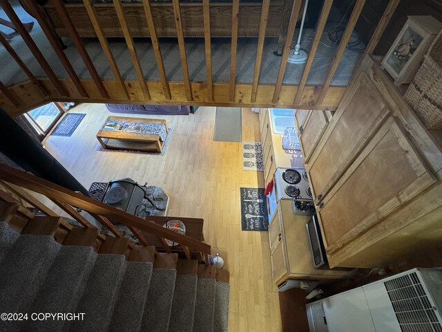 34335 Keystone Dr, Soldotna, AK 99669 - staircase featuring wood-type flooring