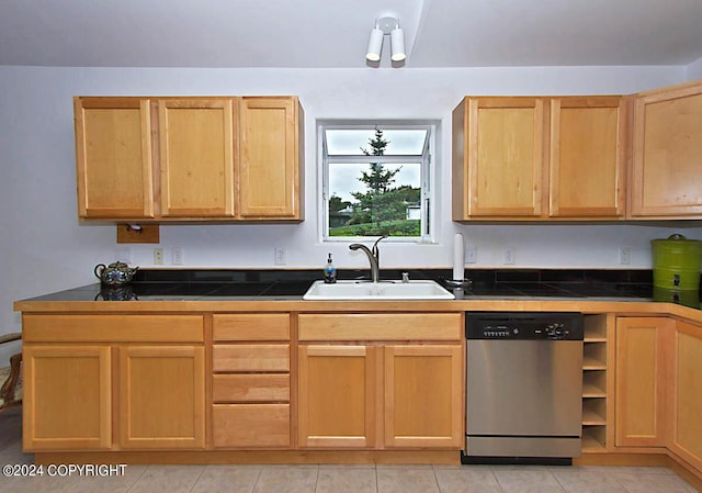 kitchen featuring a sink, tile countertops, stainless steel dishwasher, and light brown cabinets