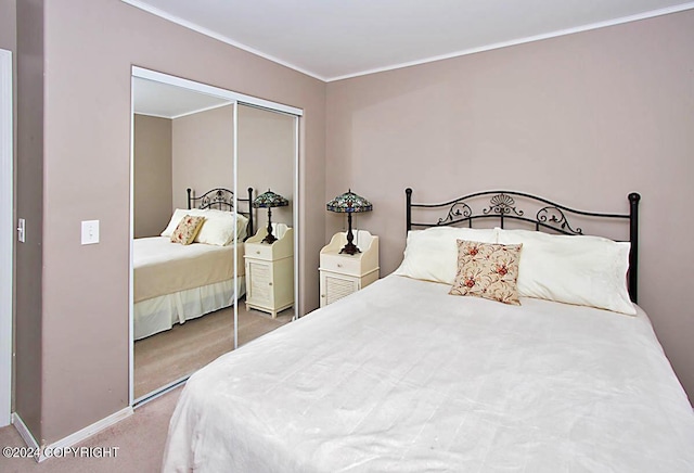 bedroom featuring crown molding, carpet, a closet, and baseboards