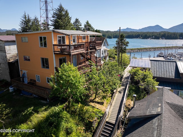 exterior space featuring a water and mountain view