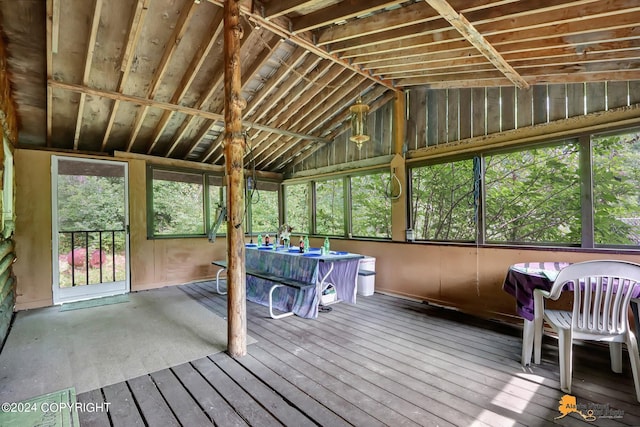 unfurnished sunroom with vaulted ceiling