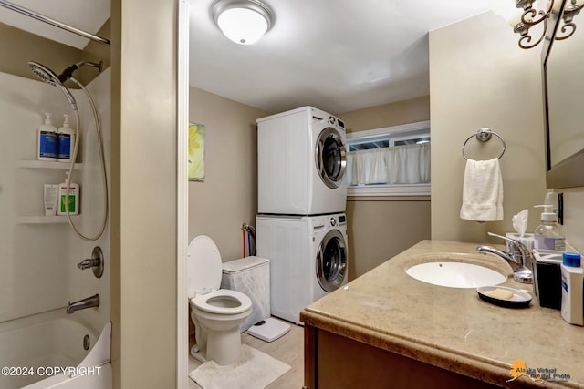 full bathroom featuring vanity, stacked washer and dryer, shower / tub combination, and toilet