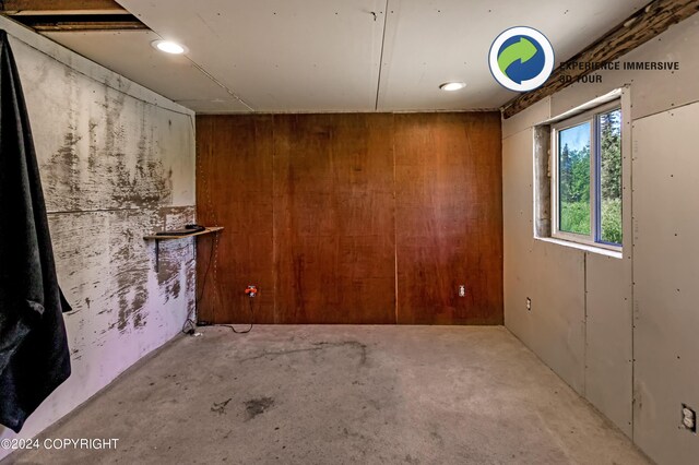 interior space featuring wood walls