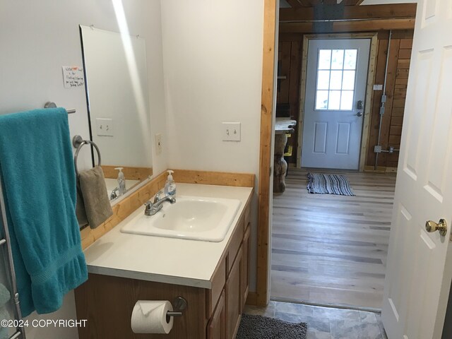 bathroom with vanity and hardwood / wood-style floors