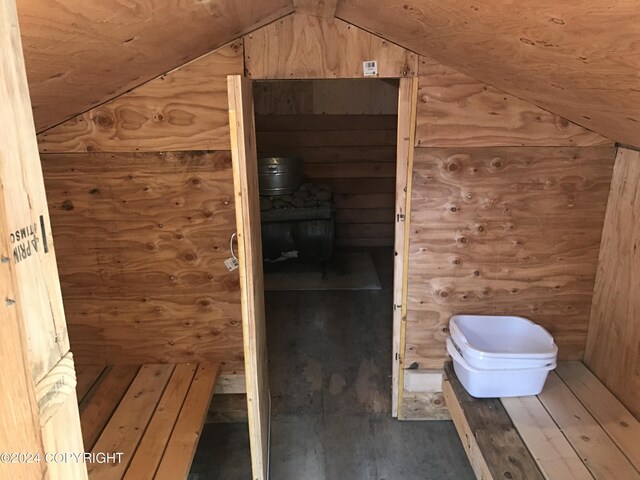 view of sauna featuring wooden walls