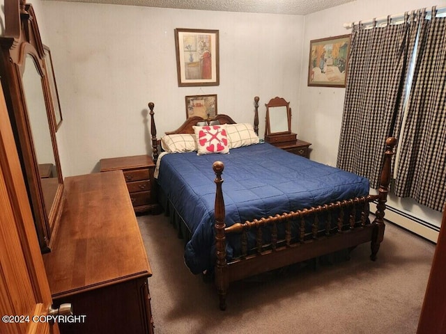 bedroom featuring dark carpet, a baseboard heating unit, and a textured ceiling