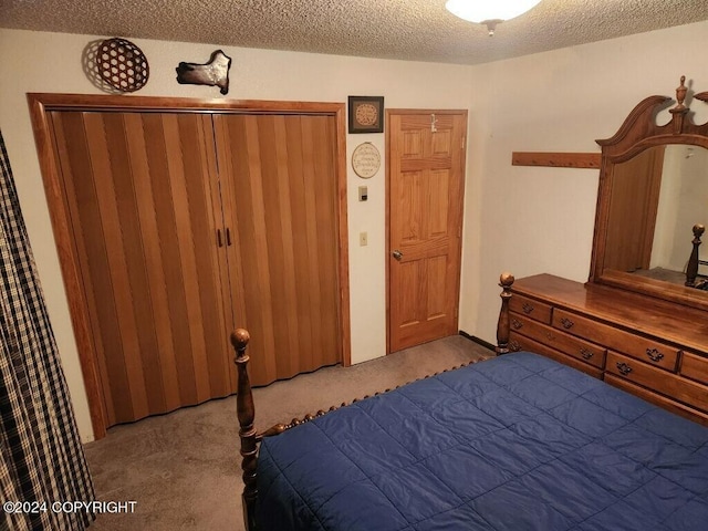 carpeted bedroom with a textured ceiling