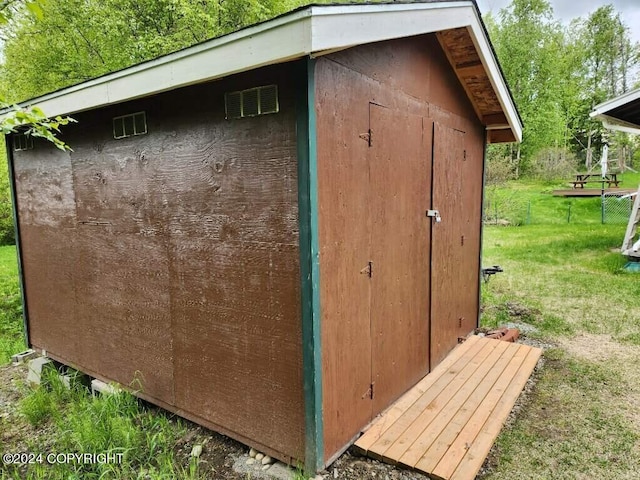 view of outdoor structure with a lawn