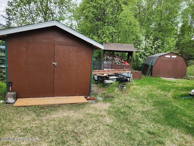 view of outbuilding featuring a lawn